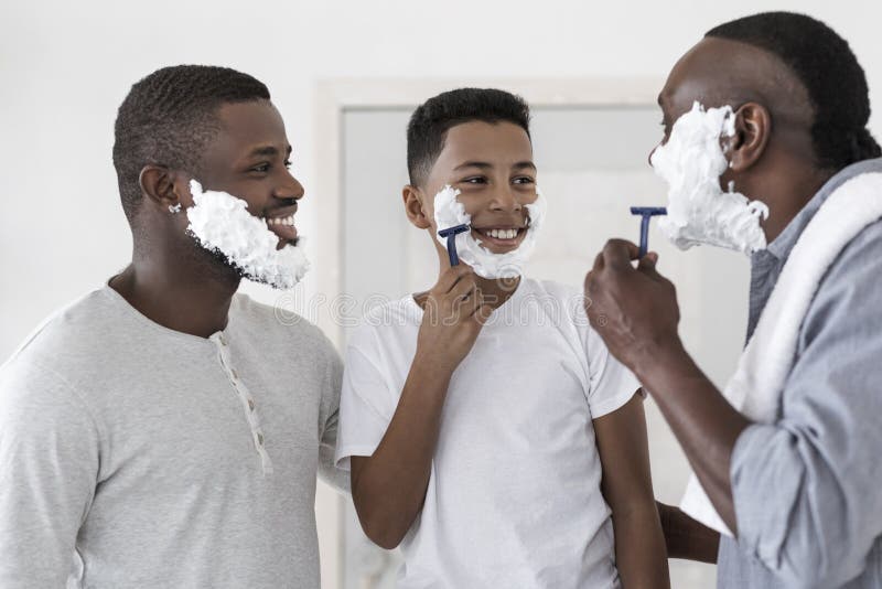 Male Family Traditions. Father And Grandfather Teaching Black Preteen Boy Shaving
