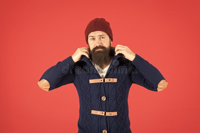 Stylish and comfortable. Man bearded hipster posing confidently in warm  black jacket or parka. Hipster modern fashion. Guy wear hat and black  winter jacket. Hipster style menswear. Hipster outfit Stock Photo by ©