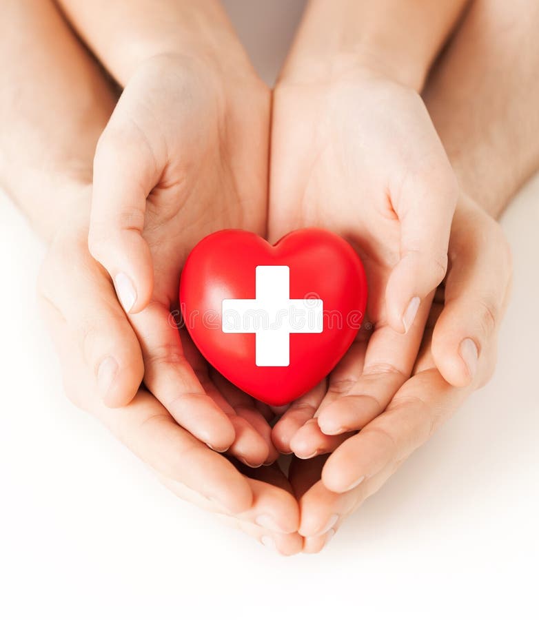 Male and female hands with red heart