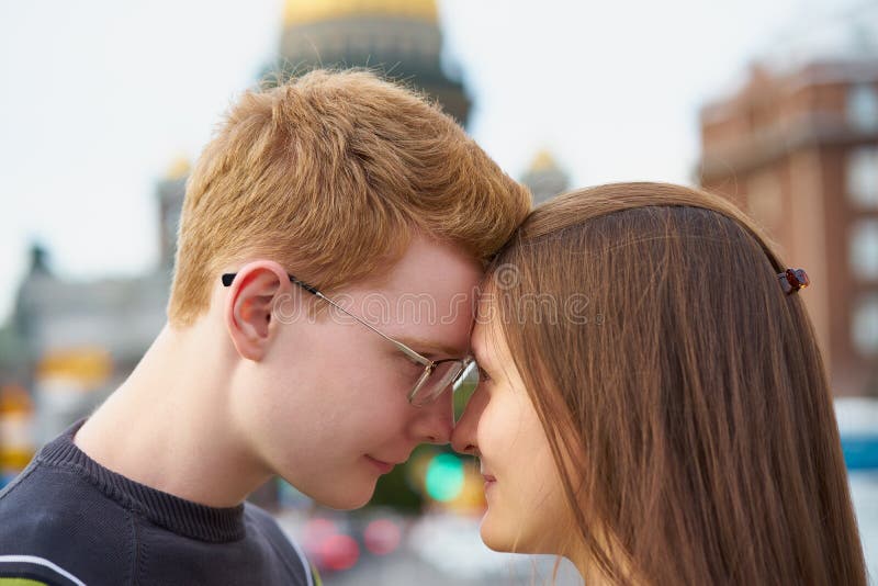 The boy looks tenderly at girl and wants to kiss. Concept of teenage love  and first kiss 7542624 Stock Photo at Vecteezy