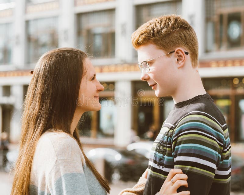 The boy looks tenderly at girl and wants to kiss. Concept of teenage love  and first kiss 7542624 Stock Photo at Vecteezy