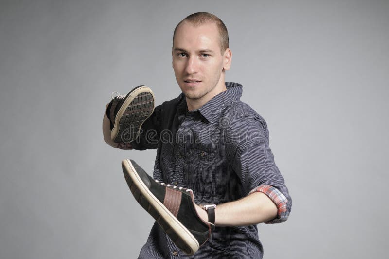 Male fighting with shoes