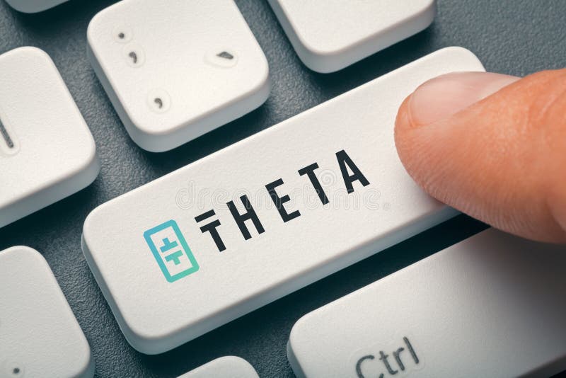Finger pressing computer key with theta token logo royalty free stock photos