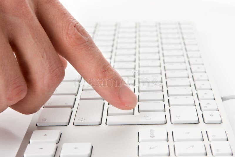 Male finger pressing computer keys stock images