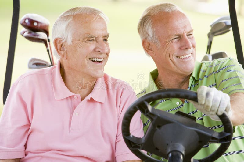 Male Friends Enjoying A Game Of Golf