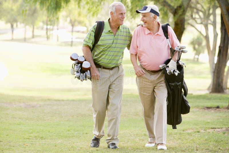 Male Friends Enjoying A Game Of Golf