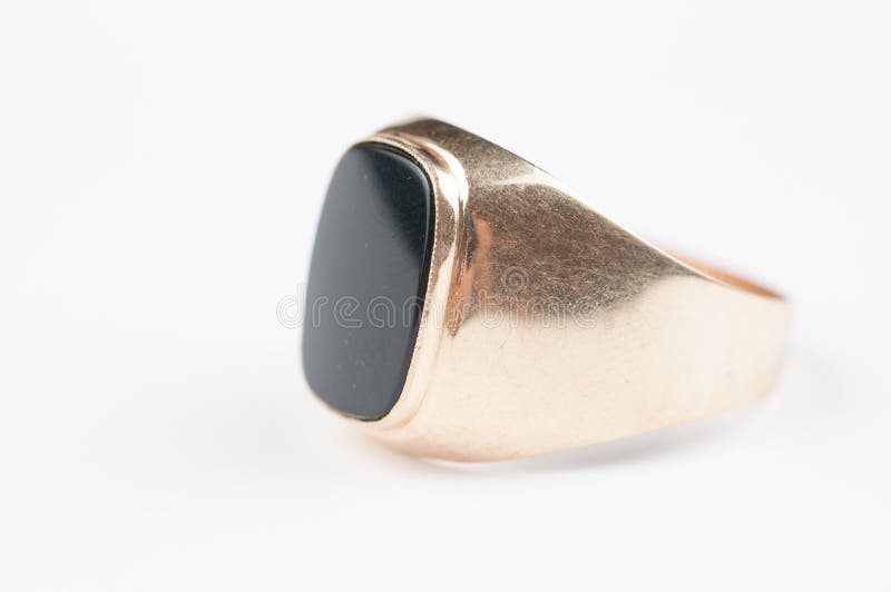 Male Golden Ring with Black Stone on a White Background Stock Image