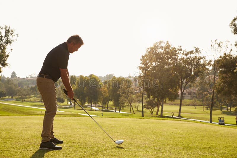 Male Golfer Lining Up Tee Shot on Golf Course Stock Image Image of