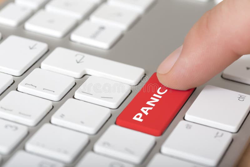 Male Hand Clicking red panic button on computer