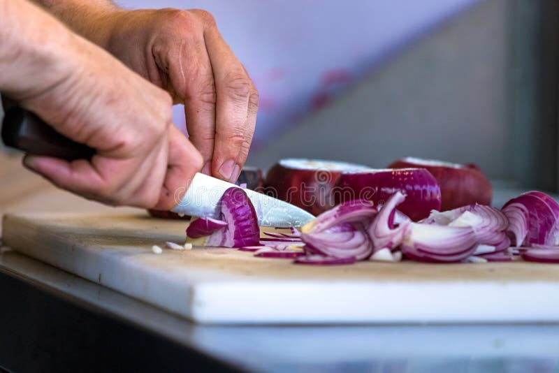 Male Hand Cutting - Chopping Red Onions, Sun Light. Stock Image - Image ...