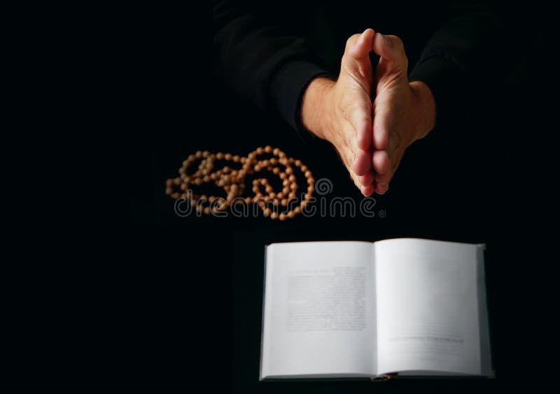 Male hand folded in prayer stock image Male hand folded in prayer stock image