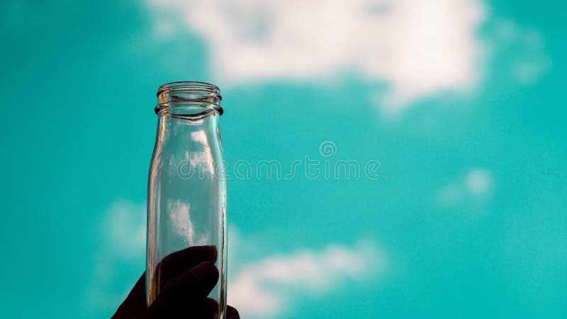 Hand Hold Transparent Empty Bottle Fill with Blue Sky Stock Image - Image  of male, cloud: 148293161