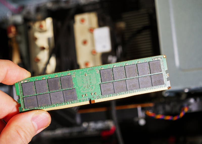 Male hand holding computer RAM DDR4 random access memory with computer royalty free stock photography