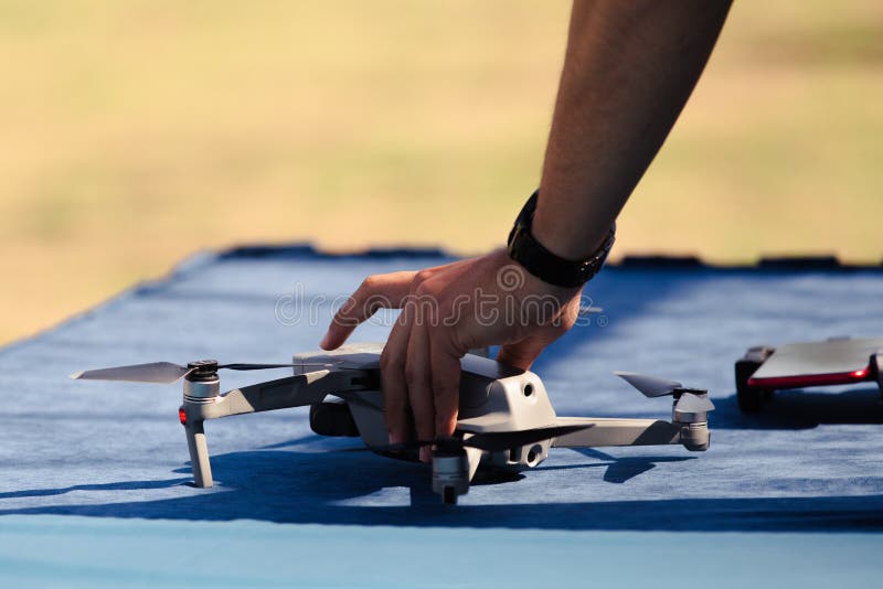 A Male Hand Holding a Drone. Preparing the Drone for Flight Stock Image