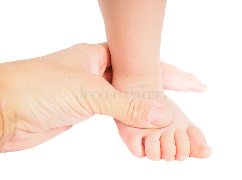 Male hand holding firmly around a foot of toddler isolated