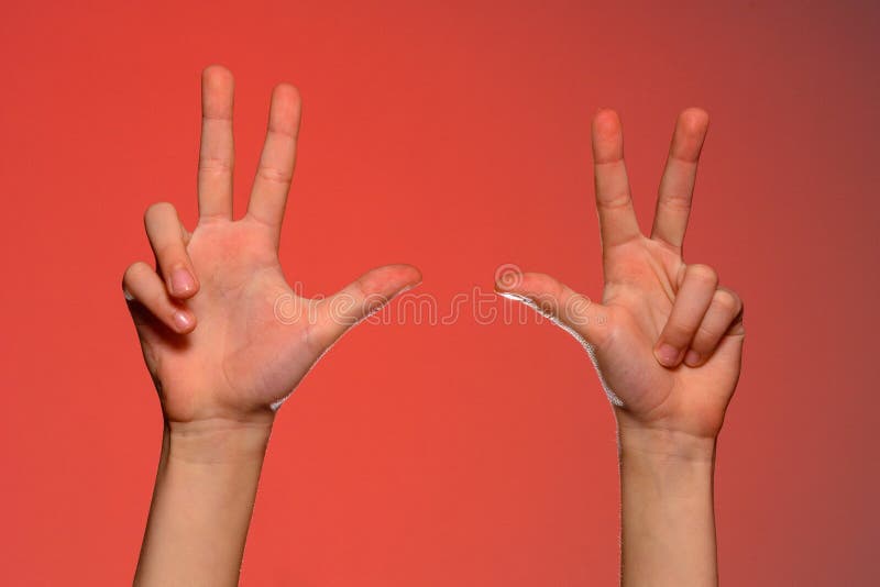 Male hand is showing three fingers isolated on red background 2019