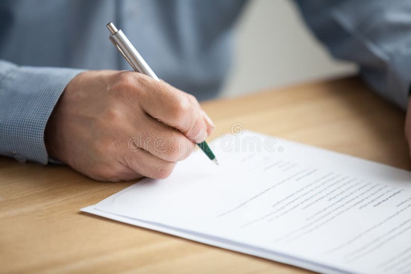 Male hand signing document, senior man putting signature on pape stock photos Male hand signing document, senior man putting signature on pape stock photos