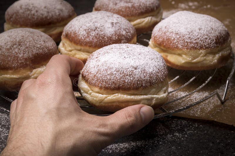 Male hand taking tasty donut royalty free stock photography Male hand taking tasty donut royalty free stock photography