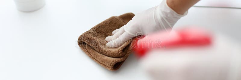 Male hand in white latex gloves wipes dust off