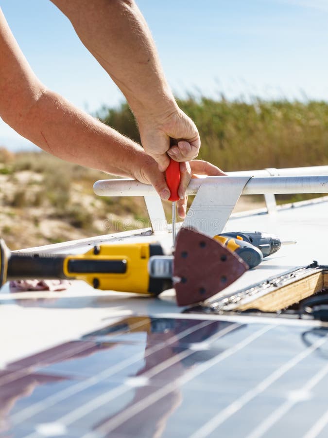 RV Solar Panel Installation. Caravan Roof Repair Stock Photo - Image of Installing Solar Panels On Rv Rubber Roof