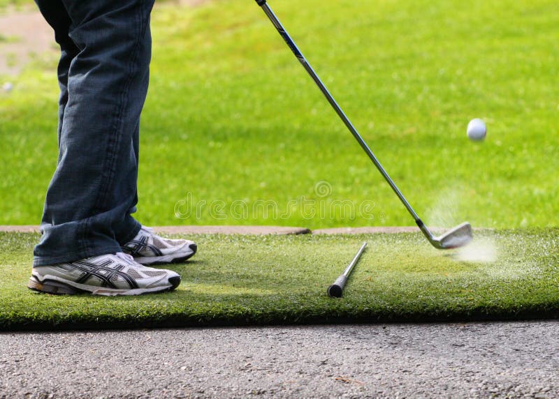 A Male hitting golf ball stock image. Image of spray 19171059