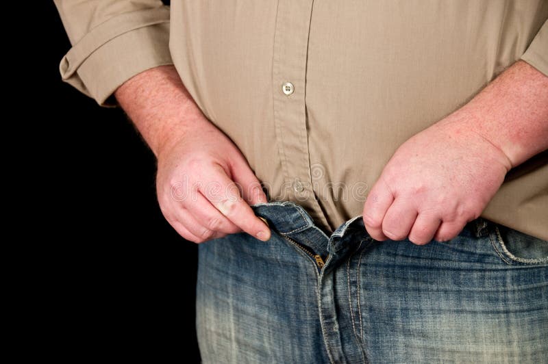 Male in jeans open waistline on black background stock photos Male in jeans open waistline on black background stock photos
