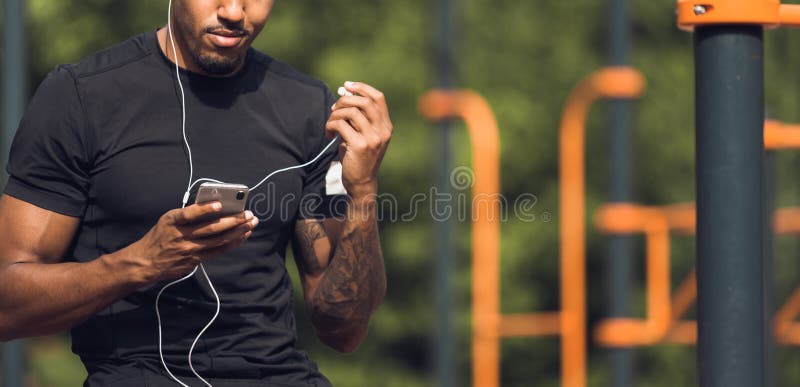 Male Jogger Listening Music Taking Break After Morning Training royalty free stock images Male Jogger Listening Music Taking Break After Morning Training royalty free stock images