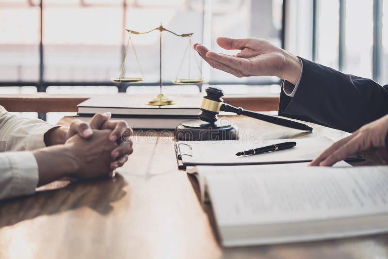 Male lawyer or judge consult having team meeting with Businesswoman client, Law and Legal services concept stock images Male lawyer or judge consult having team meeting with Businesswoman client, Law and Legal services concept stock images