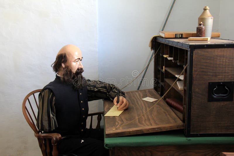 Male Mannequin sitting at desk, writing letters to family during war reenactments, Fort Ontario, New York, 2016 royalty free stock photos Male Mannequin sitting at desk, writing letters to family during war reenactments, Fort Ontario, New York, 2016 royalty free stock photos