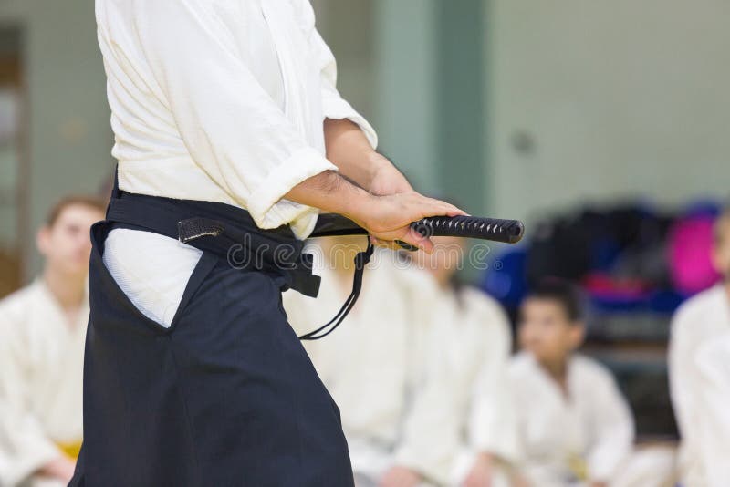 A Male Martial Arts Instructor with Katana on Seminar Stock Photo