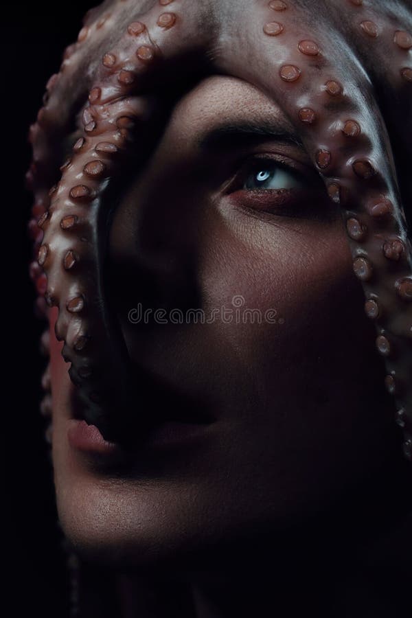 Male model close up portrait with make up and octopus, sea life concept