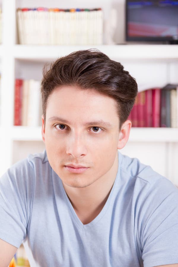 Male Model Posing In Blue T-shirt Stock Photo - Image of indoors