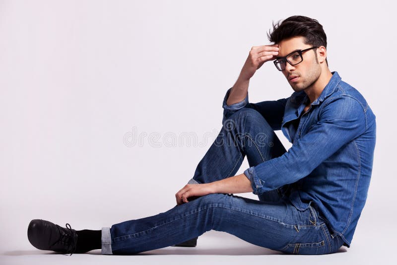 Male Model Sitting On Grey Background And Thinking Royalty 