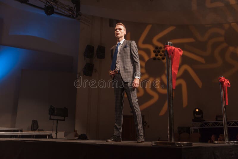 Male model standing on the catwalk during a fashion show stock photos Male model standing on the catwalk during a fashion show stock photos