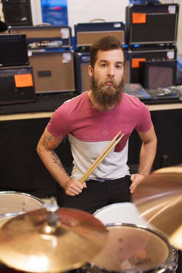 Male Musician Playing Cymbals at Music Store Stock Photo - Image of ...