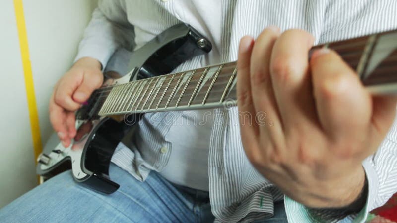 Male musician playing guitar