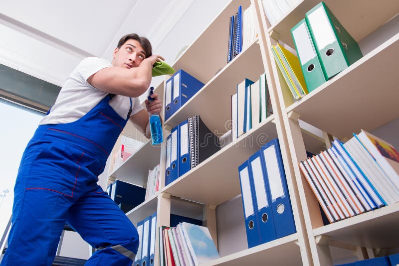 The Male Office Cleaner Cleaning Shelves in Office Stock Photo Image of overtime, cleaning