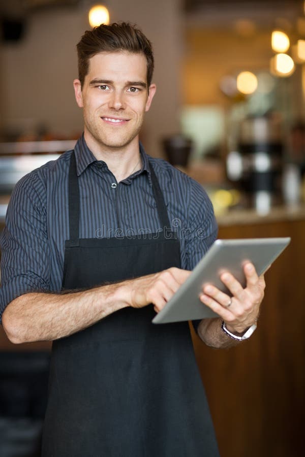 Male Owner Holding Digital Tablet in Cafeteria Stock Photo - Image of