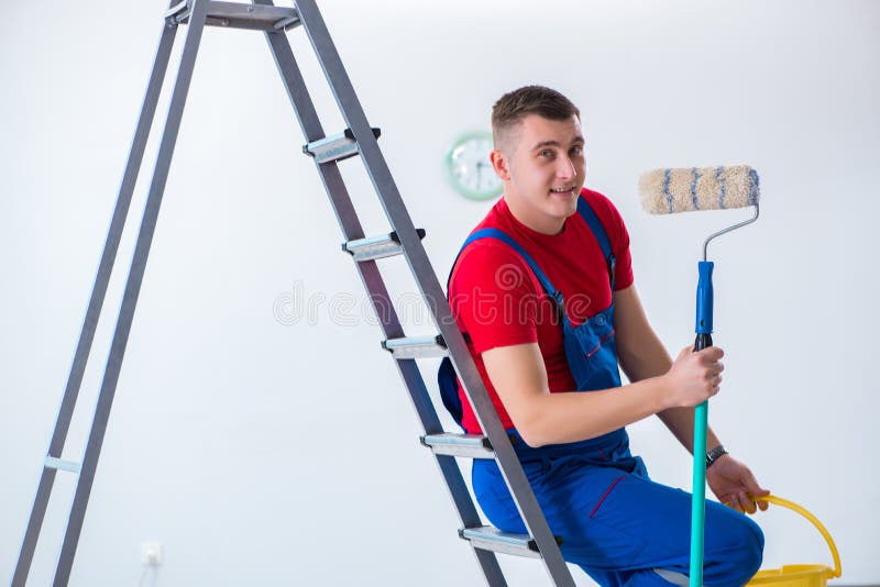 The Male Painter Preparing for Painting Job at Construction Site Stock