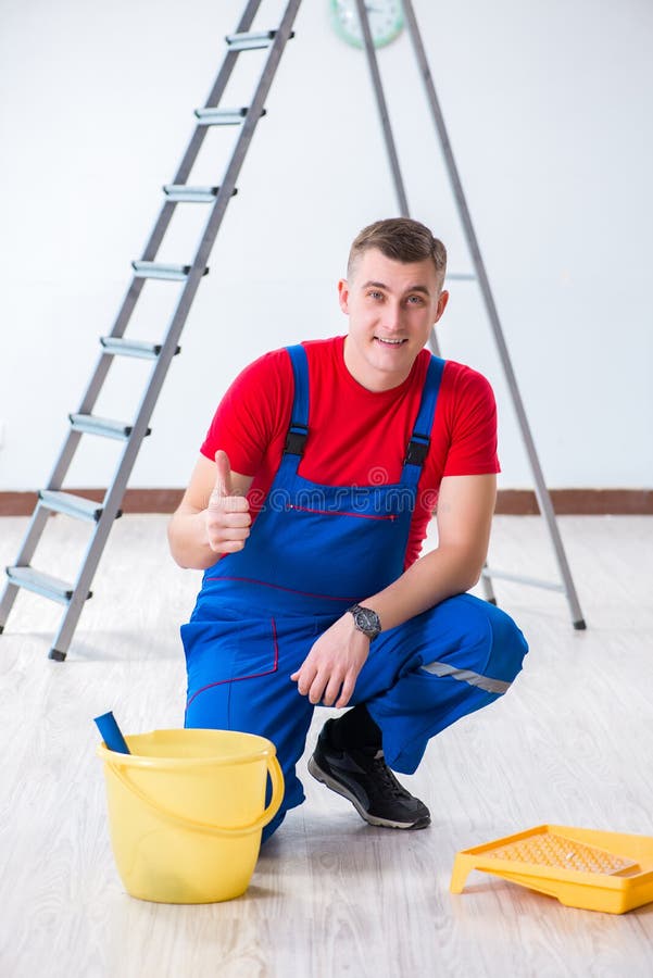 The Male Painter Preparing for Painting Job at Construction Site Stock