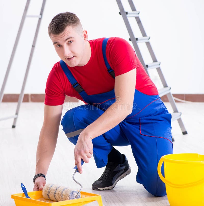 Male Painter Preparing for Painting Job at Construction Site Stock