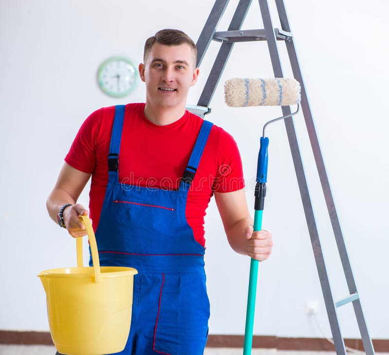 Male Painter Preparing for Painting Job at Construction Site Stock