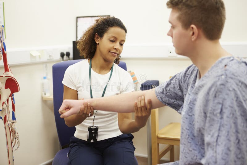 Male Patient Having Physiotherapy In Hospital stock photos Male Patient Having Physiotherapy In Hospital stock photos