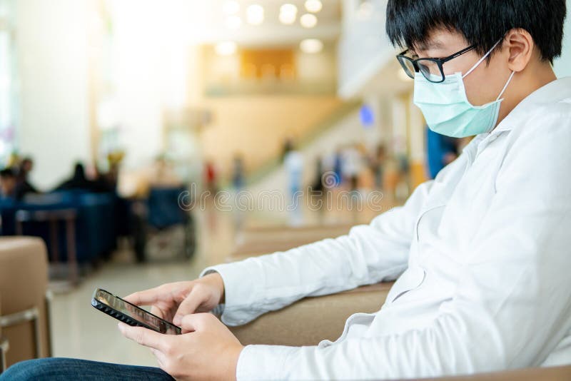 Male patient using smartphone in hospital royalty free stock photo Male patient using smartphone in hospital royalty free stock photo
