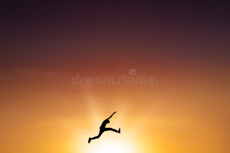 Male person leaps on the air at dusk time