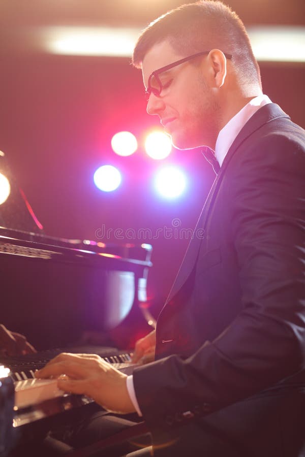 Pianist Playing on Black Grand Piano Stock Photo Image of library