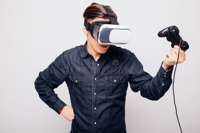 Male Playing Video Games with Virtual Reality Headset and Joystick or