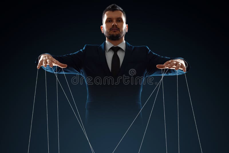 Male, puppeteer controls with threads. The concept of world conspiracy, world government, manipulation, world control
