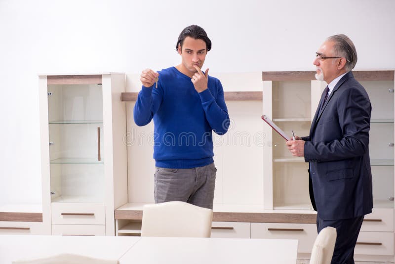 Male Real Estate Agent and Male Client in the Apartment Stock Image