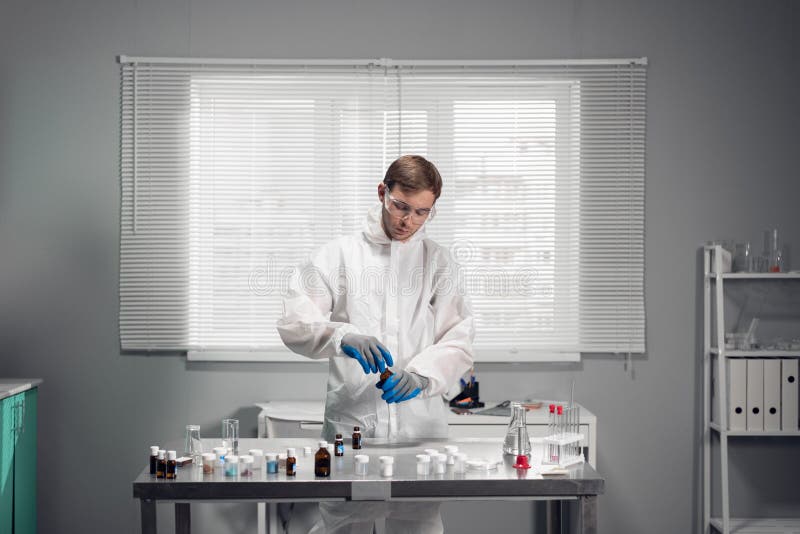 A male scientist testing some chemical in a science Laboratory. Science Laboratory Concept royalty free stock image